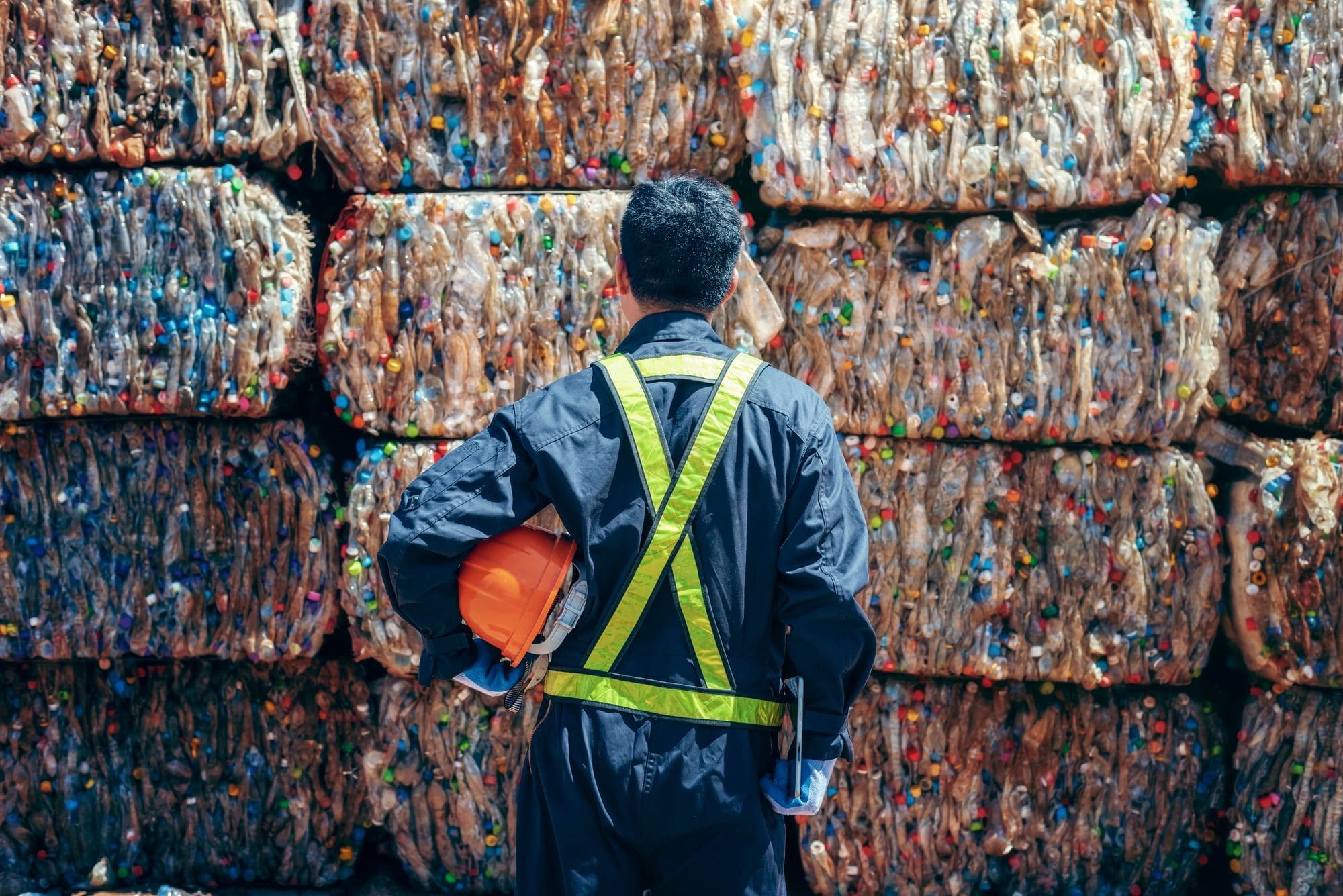 Man Looking Back The Plastic Bottle In The Recycling Industry